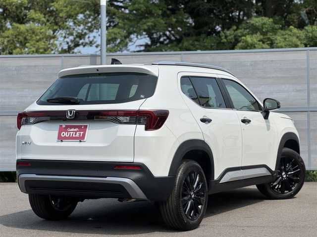 ホンダ ＷＲ－Ｖ Z+ ブラックスタイル 三重県 2025(令7)年 0.1万km未満 プラチナホワイトパール 登録未使用車/ホンダセンシング /・衝突軽減ブレーキ/・誤発進抑制機能/・後方誤発進抑制機能/・近距離衝突軽減ブレーキ/・歩行者事故低減ステアリング/・路外逸脱抑制機能/・アダプティブクルーズコントロール/・車線維持支援システム/・先行車発進お知らせ機能/・標識認識機能/・オートハイビーム/・パーキングセンサーシステム/ナビ装着用スペシャルパッケージ/・ステアリングスイッチ/　(オーディオ/ナビ/ハンズフリー/音声認識)/・リアワイドカメラ/・車載通信機/・Bluetoothユニット/パドルシフト/USBジャック(運転席)/充電用USBジャック(助手席)/純正17インチ5本マルチスポークフルブラック塗装アルミホイール/ブラックドアミラー/ブラックアウトサイドドアハンドル/シルバールーフレール/フルLEDヘッドランプ/・オートライト/LEDフロントフォグランプ/プッシュエンジンスタート/スマートキー×2