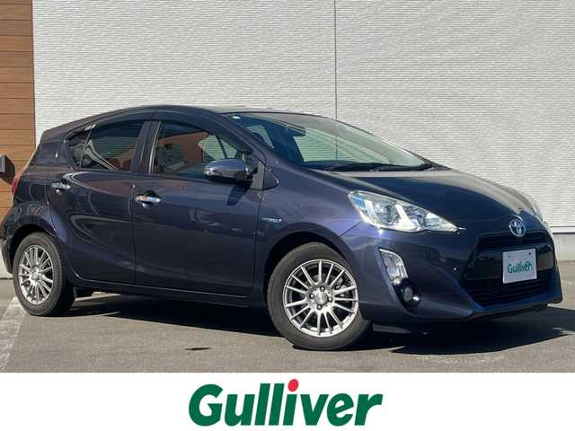 トヨタ アクア G 秋田県 2015(平27)年 5.7万km ダークバイオレットマイカメタリック 純正SDナビ（DVD/CD再生可能）/フルセグ/バックカメラ/アイドリングストップ/プッシュスタート/クルーズコントロール追従走行なし/車両接近通報装置/ステアリングスイッチ/前席シートヒーター/ビルトインETC/社外15インチアルミ（夏タイヤ装着）/スマートキー/純正フロアマット/社外ドアバイザー/オートライト/オートエアコン/パワーステアリング/パワーウィンドウ/ヘッドライトレベライザー/横滑り防止/寒冷地仕様/電動格納ウィンカーミラー/保証書/取扱説明書/記録簿/スペアキー×１