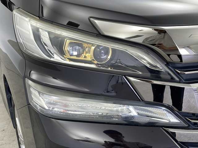 トヨタ ヴェルファイア Z Aエディション ゴールデンアイズ 鹿児島県 2016(平28)年 4.9万km バーニングブラッククリスタルシャインガラスフレーク 純正ナビ/（CD/DVD/BT/フルセグTV）/純正フリップダウンモニター/クルーズコントロール/両側パワースライドドア/ハーフレザーシート/オットマン/ビルトインETC/AC100V/純正ドライブレコーダー/純正フロアマット/純正AW/MTモード付AT/スマートキー/プッシュスタート/取説、保証書