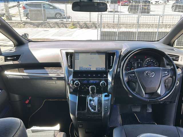トヨタ ヴェルファイア Z Aエディション ゴールデンアイズ 沖縄県 2016(平28)年 4.9万km バーニングブラッククリスタルシャインガラスフレーク 純正ナビ/（CD/DVD/BT/フルセグTV）/純正フリップダウンモニター/クルーズコントロール/両側パワースライドドア/ハーフレザーシート/オットマン/ビルトインETC/AC100V/純正ドライブレコーダー/純正フロアマット/純正AW/MTモード付AT/スマートキー/プッシュスタート