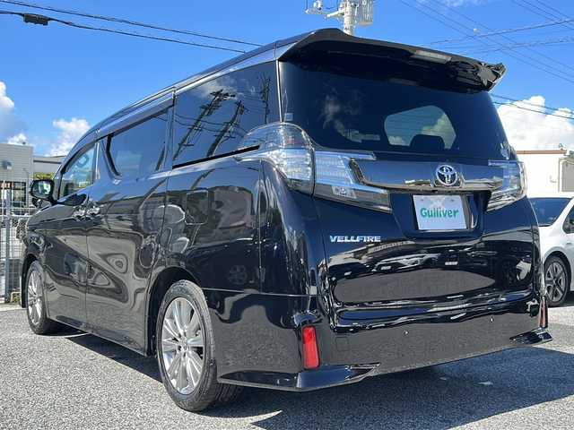 トヨタ ヴェルファイア Z Aエディション ゴールデンアイズ 沖縄県 2016(平28)年 4.9万km バーニングブラッククリスタルシャインガラスフレーク 純正ナビ/（CD/DVD/BT/フルセグTV）/純正フリップダウンモニター/クルーズコントロール/両側パワースライドドア/ハーフレザーシート/オットマン/ビルトインETC/AC100V/純正ドライブレコーダー/純正フロアマット/純正AW/MTモード付AT/スマートキー/プッシュスタート