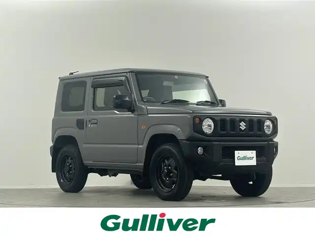 スズキ ジムニー XL 埼玉県 2023(令5)年 0.7万km ミディアムグレー 禁煙車　純正ナビ　CD　DVD　BT　フルセグTV　シートヒーター　ETC　電格ミラー　背面タイヤ　ダウンヒルアシストコントロール　アンチブレーキシステム　横滑り防止装置　オートライト