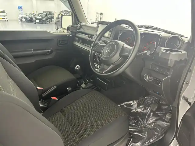 スズキ ジムニー XL 埼玉県 2023(令5)年 0.7万km ミディアムグレー 禁煙車　純正ナビ　CD　DVD　BT　フルセグTV　シートヒーター　ETC　電格ミラー　背面タイヤ　ダウンヒルアシストコントロール　アンチブレーキシステム　横滑り防止装置　オートライト