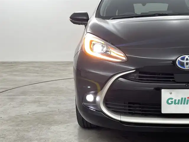 トヨタ アクア Z 福島県 2025(令7)年 0.8万km ブラック トヨタ セーフティセンス/・プリクラッシュセーフティ/・レーントレーシングアシスト/・レーダークルーズコントロール/・オートマチックハイビーム/・ロードサインアシスト/・先行車発進告知機能：/・パーキングサポートブレーキ/・ブラインドスポットモニター/・パノラミックビューモニター/・緊急時操舵支援/・プロアクティブドライビングアシスト/・カラーヘッドアップディスプレイ/純正ディスプレイオーディオ/・Bluetooth/AM・FM/USB/・バックカメラ/・360度カメラ/・ETC/デジタルインナーミラー型前方ドライブレコーダー/プッシュスタート/・スマートキー/フロアマット/革巻きステアリング/・ステアリングスイッチ/電装格納ミラー/LEDライト/・フォグライト/・ヘッドライトリベライザー