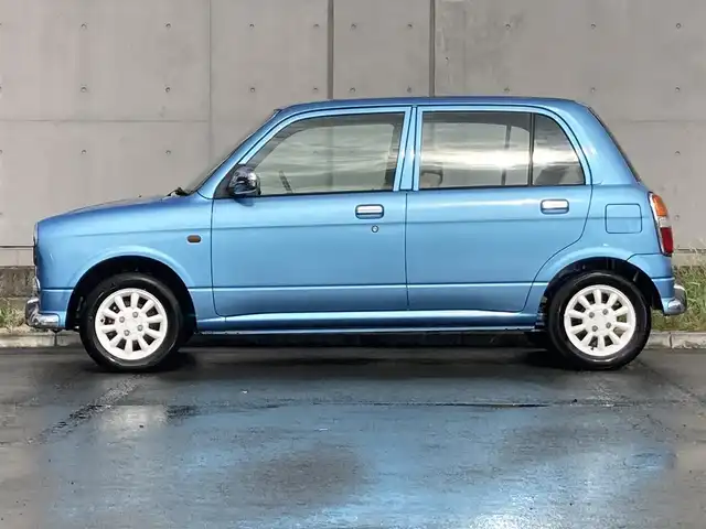 ダイハツ ミラ ジーノ 静岡県 2002(平14)年 8.7万km ライトブルー 社外ディスプレイオーディオ(FH-780DVD)/　AM FM CD DVD/本木製/革巻きステアリング/丸型ハロゲンヘッドランプ/ベージュチェック柄ファブリックシート/純正フロアマット/リモコンキー/スペアキー有/マニュアルエアコン/取扱説明書/ブラウン木目調センターパネル/13インチ白アルミホイール