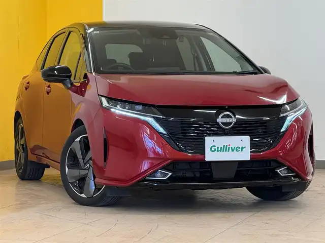 日産 オーラ G レザーエディション 群馬県 2022(令4)年 7.1万km ガーネットレッド/スーパーブラック 2トーン 安全性能/・プロパイロット/・エマージェンシーブレーキ/・車線逸脱防止支援/・ブラインドスポットモニター/・速度標識表示/・駐車支援/純正9インチメモリナビ/　　フルセグ/Bluetooth/    USB/HDMI/FM/AM/    AppleCarPlay/AndroidAuto/BOSEサウンド/アラウンドビューモニター/デジタルインナーミラー/オートLEDヘッドライト/フォグランプ/黒革シート/前席シートヒーター/ステアリングヒーター/置くだけ充電/スマートキー2本/純正フロアマット/純正17AW/前後ドライブレコーダー/ビルドインETC2.0