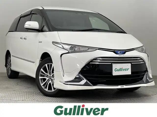 トヨタ エスティマ ハイブリッド アエラス プレミアム 道央・札幌 2018(平30)年 3.7万km ホワイトパールクリスタルシャイン ・4WD/・寒冷地仕様/・純正ナビ/　BT/SD/CD/DVD/USB/HDMI/フルセグ/・バックカメラ/・純正ビルトインETC/・前方ドライブレコーダー/・フリップダウンモニター/・クルーズコントロール/・衝突軽減ブレーキ/・レーンキープアシスト/・横滑り防止/・先行車発進アラーム/・MODELLISTAエアロ/　フロント/サイド/リア/・両側パワースライドドア/・D席パワーシート/・LEDヘッドライト/・オートライト/・オートマチックハイビーム/・社外スタッドレスAW積込（215/60/R17）/・純正フロアマット/・プッシュスタート/・スマートキー×2