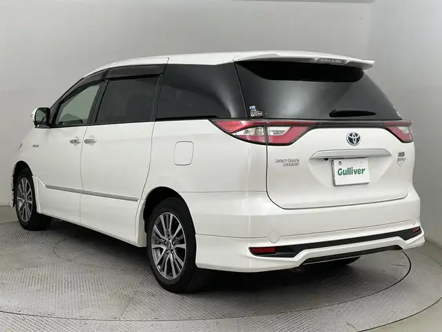 トヨタ エスティマ ハイブリッド アエラス プレミアム 道央・札幌 2018(平30)年 3.7万km ホワイトパールクリスタルシャイン ・4WD/・寒冷地仕様/・純正ナビ/　BT/SD/CD/DVD/USB/HDMI/フルセグ/・バックカメラ/・純正ビルトインETC/・前方ドライブレコーダー/・フリップダウンモニター/・クルーズコントロール/・衝突軽減ブレーキ/・レーンキープアシスト/・横滑り防止/・先行車発進アラーム/・MODELLISTAエアロ/　フロント/サイド/リア/・両側パワースライドドア/・D席パワーシート/・LEDヘッドライト/・オートライト/・オートマチックハイビーム/・社外スタッドレスAW積込（215/60/R17）/・純正フロアマット/・プッシュスタート/・スマートキー×2