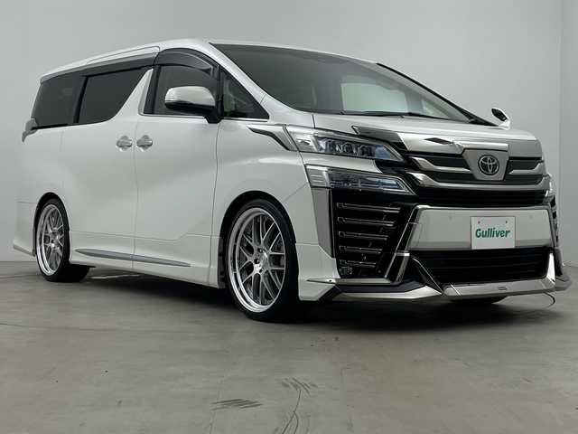 トヨタ ヴェルファイア Z Gエディション 鹿児島県 2020(令2)年 1.6万km パール 純正9インチナビゲーション/CD/DVD/SD/フルセグ/Bluetooth/デジタルインナーミラー/ローダウン/社外21インチアルミホイール/D/Nパワーシート/D/Nシートヒーター/D/Nベンチレーション/両側ぱわースライドドア/オットマン/モデリスタエアロ/ETC/純正フリップダウンモニター/LEDヘッドライト/ ブラインドスポットモニター/レーダークルーズコントロール/ビルトインETC