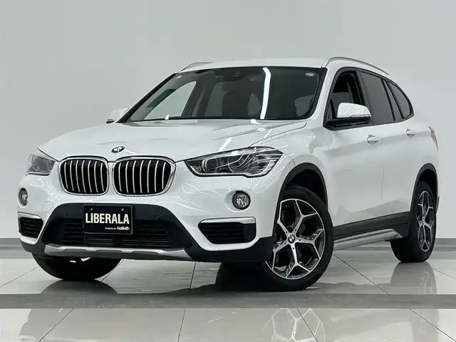 ＢＭＷ Ｘ１ xDrive 20i Xライン 岡山県 2018(平30)年 0.6万km ミネラルホワイト アドバンスドアクティブセーフティパッケージ/コンフォートアクセス/ACC/HUD/オートマチックテールゲート/ブラウンレザーシート/シートヒーター/電動シート/純正ナビ/Bカメラ