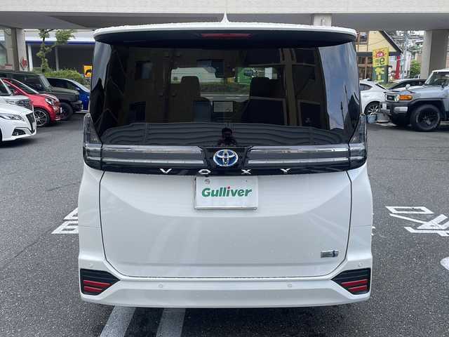 トヨタ ヴォクシー ハイブリッド S－Z 広島県 2025(令7)年 0.1万km未満 ホワイトパールクリスタルシャイン /登録時走行距離/　　　　　　　19キロ/ワンオーナー/純正ナビ/全方位モニター/地デジ/ハーフレザーシート/シートヒーター/左パワーステップ/両側パワースライドドア/パワーバックドア/2列目オットマンシート/クルーズコントロール/HUD/デジタルインナーミラー/スペアキー×１/ビルトインETC/新車時整備手帳/　　【保証書】/取扱説明書/