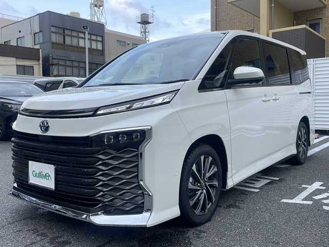 トヨタ ヴォクシー ハイブリッド S－Z 広島県 2025(令7)年 0.1万km未満 ホワイトパールクリスタルシャイン /登録時走行距離/　　　　　　　19キロ/ワンオーナー/純正ナビ/全方位モニター/地デジ/ハーフレザーシート/シートヒーター/左パワーステップ/両側パワースライドドア/パワーバックドア/2列目オットマンシート/クルーズコントロール/HUD/デジタルインナーミラー/スペアキー×１/ビルトインETC/新車時整備手帳/　　【保証書】/取扱説明書/