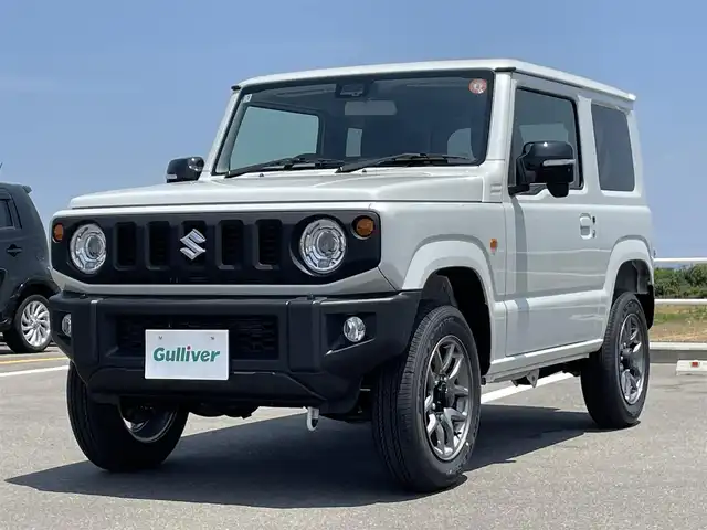 スズキ ジムニー XC 佐賀県 2025(令7)年 0.1万km未満 ピュアホワイトP ワンオーナー/パートタイム４WD/クルーズコントロール/車線逸脱警報システム/衝突被害軽減ブレーキ/クリアランスソナー/D＋N席シートヒーター/ミラーヒーター/ステアリングリモコン/オートマチックハイビーム/ウィンカーミラー/純正16インチアルミホイール/純正LEDヘッドライト/純正フォグライト/新車保証書/取扱説明書/スペアキー１本