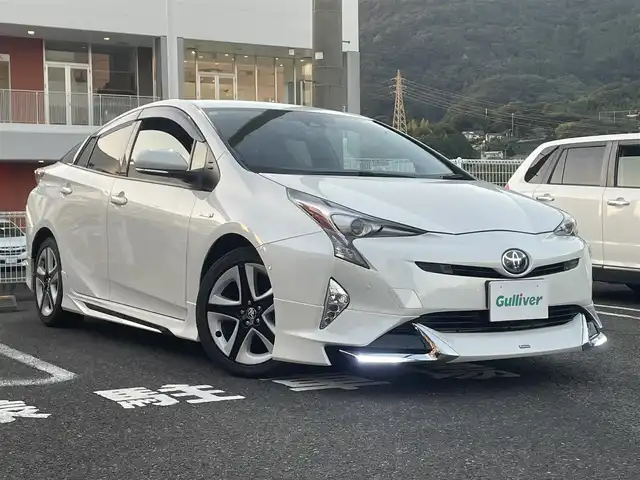 トヨタ プリウス A ツーリングセレクション 長崎県 2018(平30)年 7.6万km ホワイトパールクリスタルシャイン 社外SDナビ/・AM/FM/BT/CD/DVD/HDMI/フルセグTV/バックカメラ/モデリスタエアロ/ステアリングスイッチ/クルーズコントロール/HUD/プリクラッシュセーフティ/コーナーセンサー/BSM/ふらつき検知/ビルトインETC/前席シートヒーター/前方ドライブレコーダー/フロアマット/取扱説明書/スペアキー/エンジンスターター