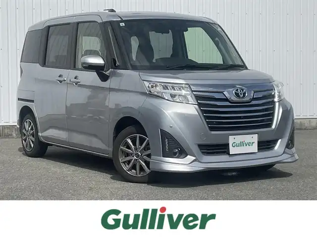 トヨタ ルーミー カスタムG 福岡県 2019(令1)年 4.4万km ブライトシルバーM スマートアシスト/衝突軽減/レーンアシスト/クリアランスソナー/クルーズコントロール/純正ナビ（ＮＳＣＮ－Ｗ６８）/ワンセグTV/CD/BT/AM/FM/AUX/全周囲カメラ/両側パワースライドドア/社外ＡＷ/ＬＥＤオートライト/オートハイビーム/フォグランプ/アイドリングストップ/スマートキー/プッシュスタート/ロールサンシェード