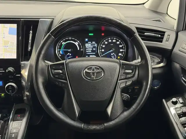トヨタ アルファードハイブリット SR Cパッケージ 三重県 2020(令2)年 4万km ホワイトパールクリスタルシャイン ハイブリッド/E-Four（4WD）/MTモード付インパネCVT/JBLプレミアムサウンド*/純正10.5インチナビ/（FM/AM/CD/DVD/Blu-ray/SDREC/SD/USB/Bluetooth/VTR/HDMI/TV/AUX/Miracast/CarPlay/AndroidAuto）/13.3インチ 後席モニター*/パノラミックビューモニター*/モデリスタエアロ（F/S/R下）/両側パワースライドドア/ドライブレコーダー 前方/ビルトイン ETC2.0/Toyota Safety Sense/・PCS/・LTA/・【OP】BSM & RCTA*1/・パーキングサポートブレーキ（静止物・後方接近車両）/・アダプティブハイビームシステム/・レーダークルコン/・ロードサインアシスト/・インテリジェントパーキングアシスト*/など/装備/・ツインムーンルーフ*/・デジタルインナーミラー*1/・合皮シート/・パワーシート（D/N）/・エグゼクティブパワーシート（電動リクライニング＆オットマン）/・パワーバックドア/・シートヒーター、ベンチレーション（D/N）/・ステアリングヒーター/・左右＆後席独立オートエアコン/・おくだけ充電*/・3眼LEDヘッドランプ/・スマートキーx2/・保/取/ナビ取/など/*メーカーOP