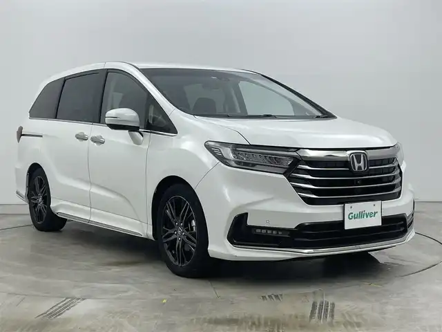 ホンダ オデッセイ ハイブリッド e:HEVアブソルート EX 岡山県 2022(令4)年 2.5万km プラチナホワイトパール ワンオーナー/プッシュスタート/アイドリングストップ/100V電源/スマートキー/ACC/ビルトインETC2.0/フルセグテレビ/純正１０インチナビ/オットマン/電動リアゲート/純正前後ドライブレコーダー/純正フロアマット/パワーシート/シートヒーター/両側パワースライドドア/純正アルミホイール/純正LEDヘッドライト/衝突被害軽減システム/オートブレーキホールド