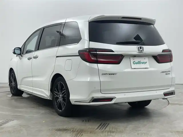 ホンダ オデッセイ ハイブリッド e:HEVアブソルート EX 岡山県 2022(令4)年 2.5万km プラチナホワイトパール ワンオーナー/プッシュスタート/アイドリングストップ/100V電源/スマートキー/ACC/ビルトインETC2.0/フルセグテレビ/純正１０インチナビ/オットマン/電動リアゲート/純正前後ドライブレコーダー/純正フロアマット/パワーシート/シートヒーター/両側パワースライドドア/純正アルミホイール/純正LEDヘッドライト/衝突被害軽減システム/オートブレーキホールド