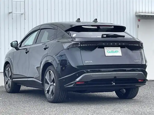 日産 アリア B9 e－4ORCE プレミア 熊本県 2024(令6)年 0.2万km パープル カラーコード：DAP（ミッドナイトパープル）/純正ナビ/・AM/FM/HDMI/BT/・AppleCarPlay/AndroidAuto/・フルセグTV/全周囲カメラ/・フロント/バック/サイド/プロパイロット/衝突防止支援/踏み間違い防止支援/後側方車両検知支援/後側方車両衝突防止支援/車両逸脱警報/車両逸脱防止支援/駐車支援/オートマチックハイビーム/純正革巻きステアリング/・ステアリングスイッチ/レザーシート/・D/N席パワーシート/・D/N席シートヒーター/・全席シートヒーター/オートライト/・LEDライト/・フォグランプ/デジタルインナーミラー/電動アームレスト/サンルーフ/ETC2.0/BOSEプレミアムサウンド/前後ドライブレコーダー/電動格納ミラー/・ウィンカーミラー/e-pedal/置くだけ充電/電動サイドブレーキ/・オートホールドボタン/パワーバックドア/フルエアロ/純正ドアバイザー/純正アルミホイール/純正フロアマット/スマートキー/・スペアキー