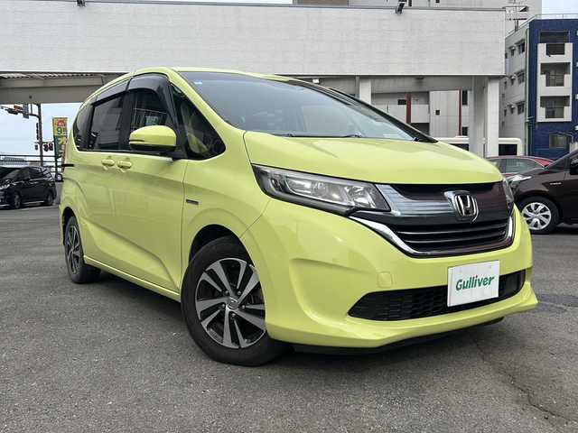 ホンダ フリード ハイブリット EX 宮崎県 2017(平29)年 14.4万km シトロンドロップ カロッツェリアナビ（AM/FM/CD/Bluetooth/フルセグTV）/バックカメラ/両側パワースライドドア/レーダークルコン/ETC/前席シートヒーター/衝突軽減ブレーキ/純正ドアバイザー/純正フロアマット