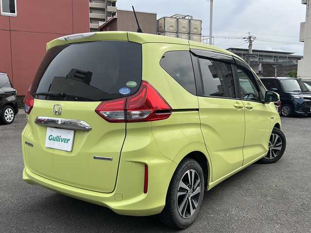 ホンダ フリード ハイブリット EX 宮崎県 2017(平29)年 14.4万km シトロンドロップ カロッツェリアナビ（AM/FM/CD/Bluetooth/フルセグTV）/バックカメラ/両側パワースライドドア/レーダークルコン/ETC/前席シートヒーター/衝突軽減ブレーキ/純正ドアバイザー/純正フロアマット