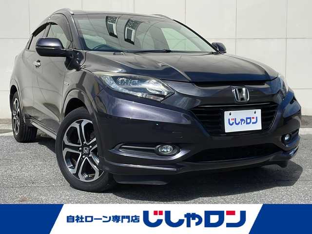 ホンダ ヴェゼル ハイブリッド Z 埼玉県 2014(平26)年 12.8万km ルーセブラックM (株)IDOMが運営する【じしゃロン熊谷店】の自社ローン専用車両になりますこちらは現金またはオートローンご利用時の価格です。自社ローンご希望の方は別途その旨お申付け下さい/純正ナビ　（VXM-142VFi）/　フルセグTV　CD/DVD/SD/Bluetooth/ワンオーナー/プッシュスタート/ステアリングスイッチ/バックカメラ/クルーズコントロール/ECONスイッチ/横滑り防止/純正フロアマット/純正17インチAW/ルーフレール/ECON/全席オートウインドウ/電子サイドブレーキ