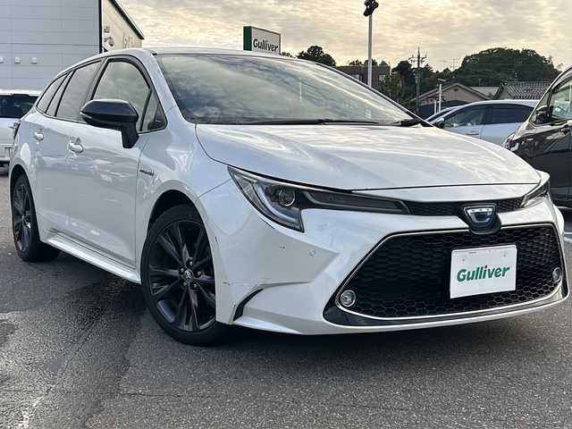 トヨタ カローラツーリング ハイブリッド ダブルバイビー 石川県 2019(令1)年 14.8万km ホワイトパールクリスタルシャイン ワンオーナー/4WD/トヨタセーフティーセンス/レーダークルーズコントロール/純正ディスプレイオーディオ(ナビ付)/【Bluetooth・フルセグTV・Miracast】/置くだけ充電/前席シートヒーター/ステアリングスイッチ/・ステアリングヒーター/ヘッドアップディスプレイ/ビルトインETC2.0