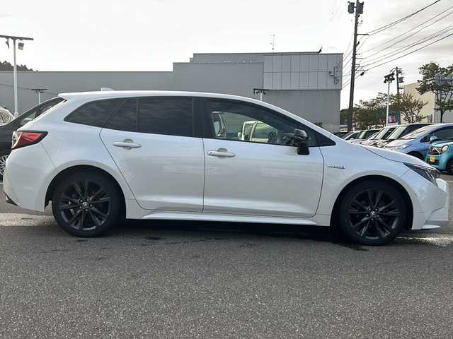 トヨタ カローラツーリング ハイブリッド ダブルバイビー 石川県 2019(令1)年 14.8万km ホワイトパールクリスタルシャイン ワンオーナー/4WD/トヨタセーフティーセンス/レーダークルーズコントロール/純正ディスプレイオーディオ(ナビ付)/【Bluetooth・フルセグTV・Miracast】/置くだけ充電/前席シートヒーター/ステアリングスイッチ/・ステアリングヒーター/ヘッドアップディスプレイ/ビルトインETC2.0