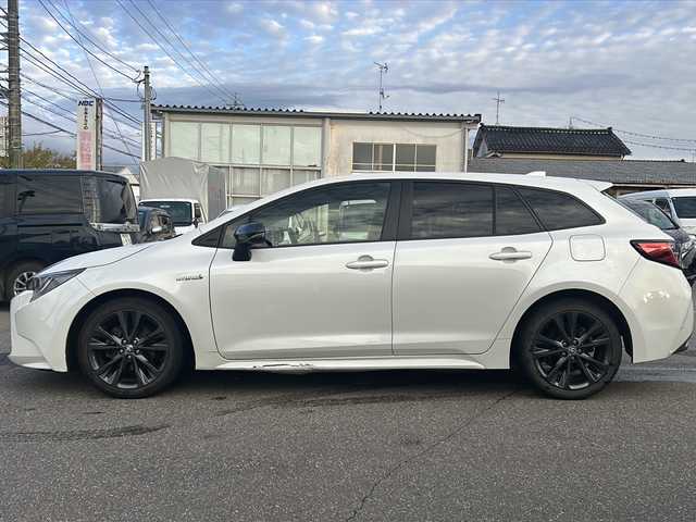 トヨタ カローラツーリング ハイブリッド ダブルバイビー 石川県 2019(令1)年 14.8万km ホワイトパールクリスタルシャイン ワンオーナー/4WD/トヨタセーフティーセンス/レーダークルーズコントロール/純正ディスプレイオーディオ(ナビ付)/【Bluetooth・フルセグTV・Miracast】/置くだけ充電/前席シートヒーター/ステアリングスイッチ/・ステアリングヒーター/ヘッドアップディスプレイ/ビルトインETC2.0