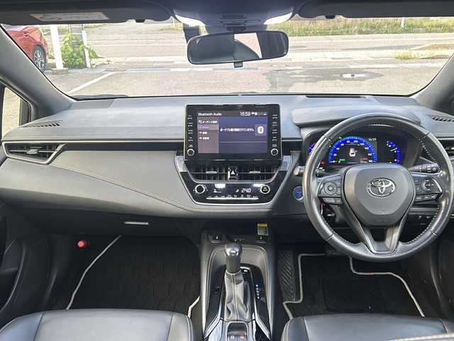 トヨタ カローラツーリング ハイブリッド ダブルバイビー 石川県 2019(令1)年 14.8万km ホワイトパールクリスタルシャイン ワンオーナー/4WD/トヨタセーフティーセンス/レーダークルーズコントロール/純正ディスプレイオーディオ(ナビ付)/【Bluetooth・フルセグTV・Miracast】/置くだけ充電/前席シートヒーター/ステアリングスイッチ/・ステアリングヒーター/ヘッドアップディスプレイ/ビルトインETC2.0