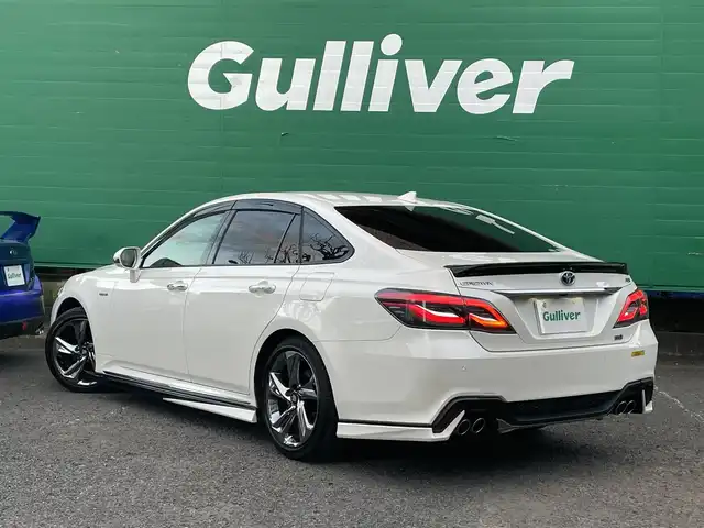 トヨタ クラウン ハイブリッド RS 東京都 2018(平30)年 4.7万km ホワイトパールクリスタルシャイン ワンオーナー/トランクスポイラー/サイドスカート/フロントスポイラー/リアバンパー/マフラー(TRD)/バックカメラ/TコネクトSDナビゲーションシステム/・SD8インチナビ/(フルセグTV/Blu-ray/DVD/USB/AUX/Bluetooth)/セーフティーセンス/・レーントレーシングアシスト/・レーダークルーズコントロール/・プリクラッシュセーフティー/・アダプティブハイビーム/ドライブレコーダー/三眼LEDヘッドランプ/シーケンシャルターンランプ/パワーシート(運転席＆助手席)/シートヒーター(運転席＆助手席)/ステアリングヒーター/革巻きステアリング/パドルシフト/ETC2.0/保証書/取扱説明書/スペアキー×1