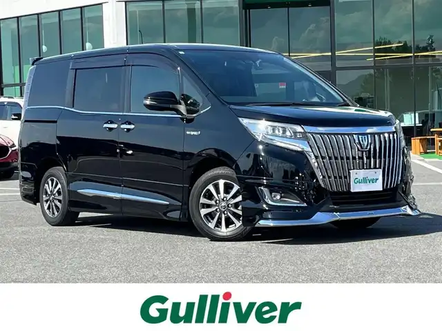 トヨタ エスクァイア ハイブリッド Gi プレミアムパッケージ 奈良県 2017(平29)年 6.8万km ブラック モデリスタエアロ/ALPINE11インチナビ（EX11Z）/（フルセグ/BT/CD/DVD)/ALPINE11インチフリップダウンモニター/クルーズコントロール/バックカメラ/プリクラッシュセーフティ/レーンキープアシスト/両側パワースライドドア/ハーフレザーシート/前席シートヒーター/ステアリングヒーター/後席サンシェード/前後ドライブレコーダー/ETC/純正15インチAW/保証書/取り扱い説明書