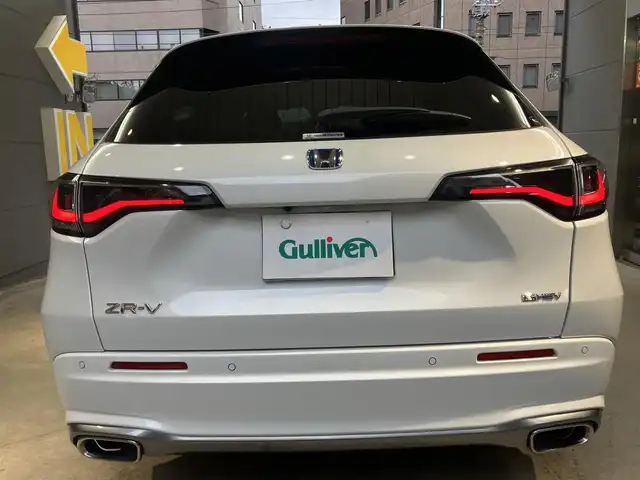 ホンダ ＺＲ－Ｖ ハイブリッド e:HEV Z 東京都 2022(令4)年 2.1万km プラチナホワイトパール ホンダセンシング/・衝突軽減ブレーキ/・ブラインドスポットモニター/・追従式クルーズコントロール/・先行車発進お知らせ機能/・誤発進抑制機能/・後方誤発進抑制機能/・渋滞追従機能付きアダクティブクルーズコントロール/BOSEサウンド/純正ナビ/（ラジオ/BT/USB/フルセグ）/全方位カメラ/ビルトインETC2.0/LEDヘッドライト/D/N席パワーシート/運転席シートメモリー/パドルシフト/オートブレーキホールド/置くだけ充電/スペアキー/保証書あり/取扱説明書あり（車両・ナビ）