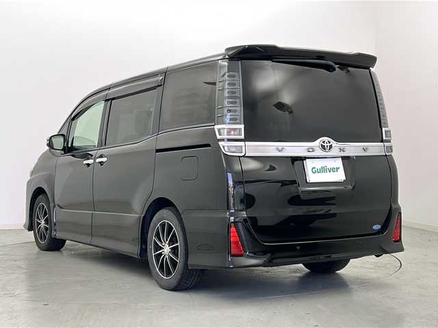 トヨタ ヴォクシー ZS 煌Ⅲ 宮城県 2020(令2)年 6.7万km イナズマスパーキングブラックガラスフレーク トヨタセーフティーセンス/・プリクラッシュセーフティー/・クルーズコントロール/・オートマチックハイビーム/・レーンディパーチャーアラート/社外9インチナビ（ALPINE）/・フルセグTV/・BT.CD/DVD.SD.USB/社外フリップダウンモニター（ALPINE）/バックカメラ/両側パワースライド/ステアリングスイッチ/社外AW/ビルトインETC/LEDヘッドライト/ドライブレコーダー（D/N)/スタッドレスタイヤ積込（純正AW）/プッシュスタート/スマートキー
