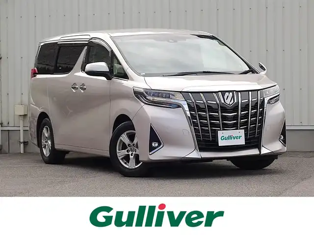 トヨタ アルファード X 山形県 2018(平30)年 9万km スティールブロンドM 純正フリップダウンモニター (V12T-R66C)/純正SDナビ/　　【CD DVD BT フルセグ MSV】/バックカメラ/両側パワースライドドア/レーダークルーズコントロール/LEDオートヘッドライト/純正16インチアルミホイール/コーナーセンサー/ステアリングスイッチ/MTモード付AT/電動格納ウィンカーミラー/フォグランプ/スマートキー×2/ETC