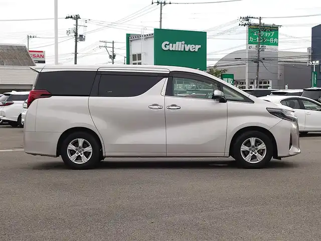 トヨタ アルファード X 山形県 2018(平30)年 9万km スティールブロンドM 純正フリップダウンモニター (V12T-R66C)/純正SDナビ/　　【CD DVD BT フルセグ MSV】/バックカメラ/両側パワースライドドア/レーダークルーズコントロール/LEDオートヘッドライト/純正16インチアルミホイール/コーナーセンサー/ステアリングスイッチ/MTモード付AT/電動格納ウィンカーミラー/フォグランプ/スマートキー×2/ETC