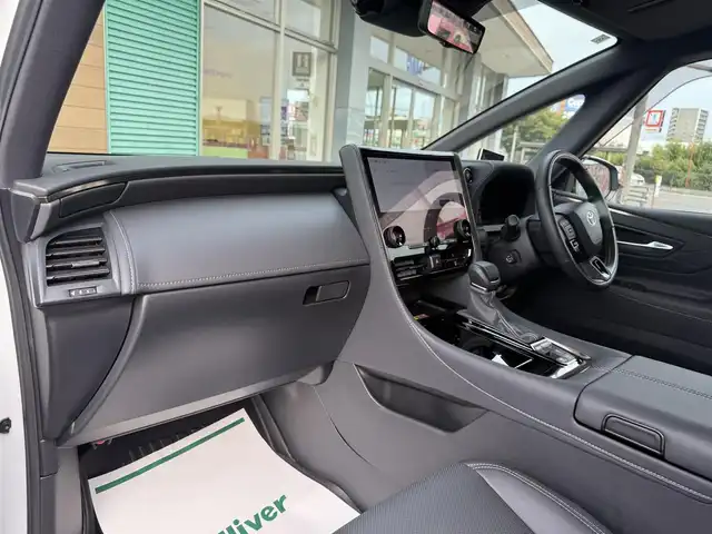 トヨタ アルファードハイブリット Z 香川県 2023(令5)年 2.8万km プラチナホワイトパールマイカ 純正メモリナビ/(フルセグ/Bluetooth/USB)/トヨタセーフティセンス/・アラウンドビューモニター/・レーダークルーズコントロール/・オートマチックハイビーム/・プリクラッシュセーフティ/・レートレーシングアシスト/・VSC/・BSM/左右独立ムーンルーフ/両側パワースライドドア/黒革シート/前席パワーシート/前席シートヒーター/オットマン/電動格納サードシート/電動リアゲート/置くだけ充電/LEDヘッドライト/前後コーナーセンサー/純正18インチアルミ