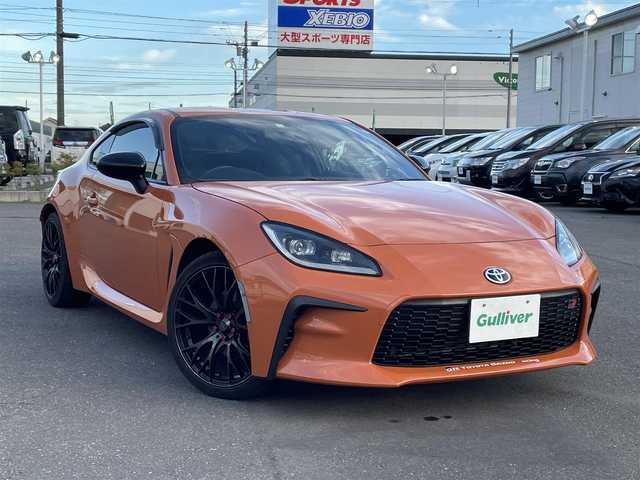 トヨタ ＧＲ８６ RZ 10thアニバーサリーLTD 道央・札幌 2023(令5)年 1.8万km フレイムオレンジ 登録時走行距離 17832km/ワンオーナー/6MT/純正ディーラーOP9インチナビ/(AM/FM/CD/DVD/BT)/フルセグTV/バックカメラ/クルーズコントロール/前席シートヒーター/ステアリングスイッチ/Wedssport18インチアルミホイール/HKSマフラー装着/純正マフラー積み込みあり/ホワイトホイール装着冬タイヤあり/(グッドイヤー2023年製・215/45R17)/LEDヘッドライト/電動格納ミラー/革巻きステアリング/プッシュスタート/室内灯LED/ドアバイザー/ロックナットあり/取説/保証書