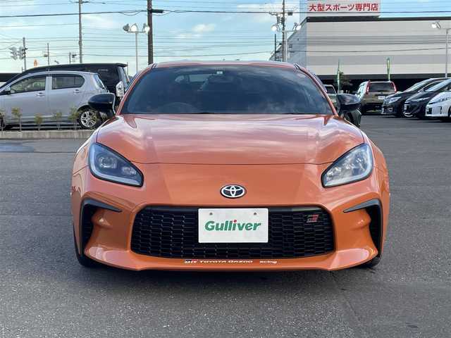 トヨタ ＧＲ８６ RZ 10thアニバーサリーLTD 道央・札幌 2023(令5)年 1.8万km フレイムオレンジ 登録時走行距離 17832km/ワンオーナー/6MT/純正ディーラーOP9インチナビ/(AM/FM/CD/DVD/BT)/フルセグTV/バックカメラ/クルーズコントロール/前席シートヒーター/ステアリングスイッチ/Wedssport18インチアルミホイール/HKSマフラー装着/純正マフラー積み込みあり/ホワイトホイール装着冬タイヤあり/(グッドイヤー2023年製・215/45R17)/LEDヘッドライト/電動格納ミラー/革巻きステアリング/プッシュスタート/室内灯LED/ドアバイザー/ロックナットあり/取説/保証書