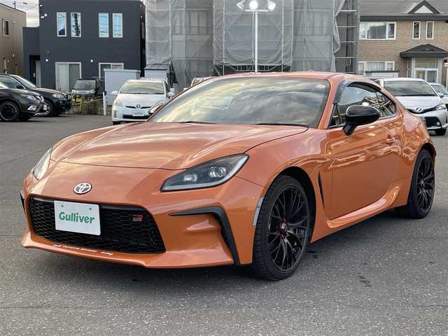 トヨタ ＧＲ８６ RZ 10thアニバーサリーLTD 道央・札幌 2023(令5)年 1.8万km フレイムオレンジ 登録時走行距離 17832km/ワンオーナー/6MT/純正ディーラーOP9インチナビ/(AM/FM/CD/DVD/BT)/フルセグTV/バックカメラ/クルーズコントロール/前席シートヒーター/ステアリングスイッチ/Wedssport18インチアルミホイール/HKSマフラー装着/純正マフラー積み込みあり/ホワイトホイール装着冬タイヤあり/(グッドイヤー2023年製・215/45R17)/LEDヘッドライト/電動格納ミラー/革巻きステアリング/プッシュスタート/室内灯LED/ドアバイザー/ロックナットあり/取説/保証書