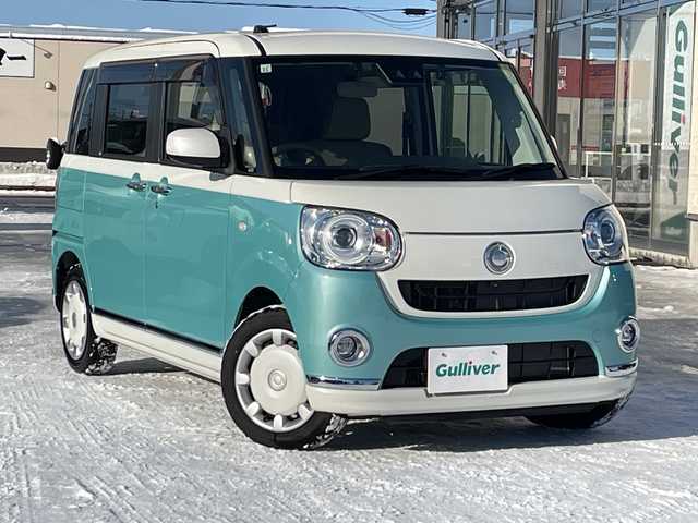 ダイハツ ムーヴ キャンバス G メイクアップ リミテッド　SAⅢ 道北・旭川 2019(令1)年 0.9万km パールホワイトⅢ/ファインミントメタリック 2トーン /4WD//禁煙車//純正ナビ/CD/DVD/BT/フルセグ/SD/HDMI//パノラミックビューモニター//両側パワースライドドア//アイドリングストップ//オートライト//スマートアシスト3/衝突軽減ブレーキ/誤発進抑制機能/対自転車・歩行者警報ブレーキ/オートハイビーム/前方発進お知らせ機能//ETC//ナビ連動ドライブレコーダー//横滑り防止//LEDヘッドライト//ステアリングスイッチ//純正フロアマット//ドアバイザー//保証書//スペアキー