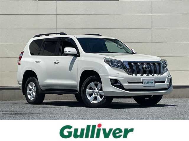 トヨタ ランドクルーザー プラド TX Lパッケージ 茨城県 2015(平27)年 9.3万km ホワイトパールクリスタルシャイン 中期型モデル/革巻きステアリング/純正メーカーナビ/フロントカメラ/サイドカメラ/バックカメラ/サンルーフ/ブラウンレザーシート/シートヒーター/電動格納サードシート/モデリスタ製エアロ/LEDヘッドライト/ビルドインETC/パワーシート/プッシュスタート