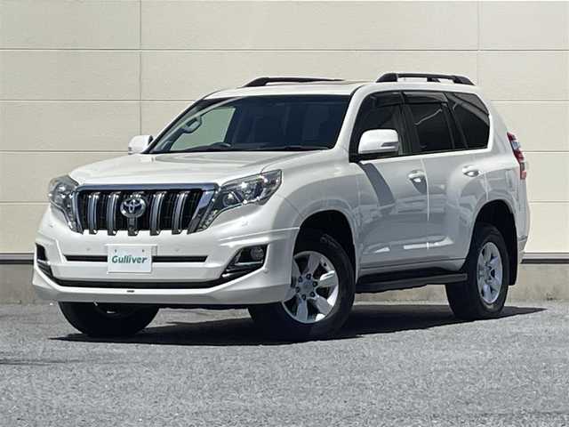 トヨタ ランドクルーザー プラド TX Lパッケージ 茨城県 2015(平27)年 9.3万km ホワイトパールクリスタルシャイン 中期型モデル/革巻きステアリング/純正メーカーナビ/フロントカメラ/サイドカメラ/バックカメラ/サンルーフ/ブラウンレザーシート/シートヒーター/電動格納サードシート/モデリスタ製エアロ/LEDヘッドライト/ビルドインETC/パワーシート/プッシュスタート