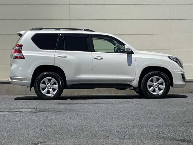 トヨタ ランドクルーザー プラド TX Lパッケージ 茨城県 2015(平27)年 9.3万km ホワイトパールクリスタルシャイン 中期型モデル/革巻きステアリング/純正メーカーナビ/フロントカメラ/サイドカメラ/バックカメラ/サンルーフ/ブラウンレザーシート/シートヒーター/電動格納サードシート/モデリスタ製エアロ/LEDヘッドライト/ビルドインETC/パワーシート/プッシュスタート
