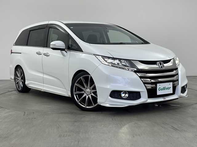 ホンダ オデッセイ アブソルート 兵庫県 2014(平26)年 6.5万km ホワイトオーキッドパール ・純正ナビ（フルセグ・CD・DVD・BT・HDMI）/・両側パワースライドドア/・クルーズコントロール/・衝突軽減ブレーキ/・社外19インチアルミホイール/・ハーフレザーシート/・LEDオートライト/・HKSサスペンション/・純正サスペンション車載/・ドライブレコーダー/・ビルトインETC/・後席オットマン/・カーテンエアバック/・ステアリングスイッチ/・アイドリングストップ/・社外フロアマット/・革巻きステアリング/・パドルシフト/・プッシュスタート/・スマートキー