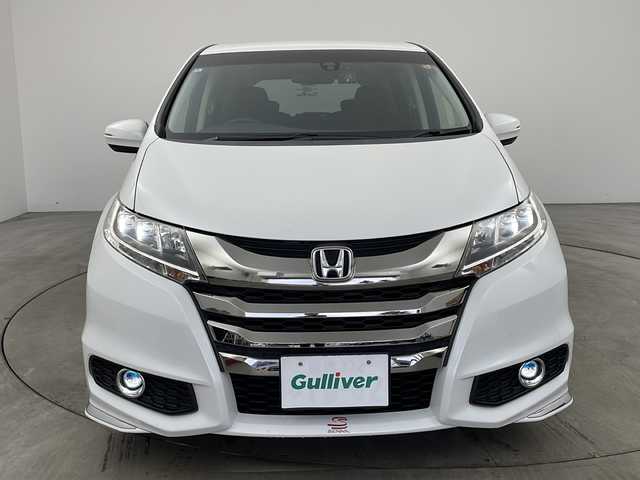 ホンダ オデッセイ アブソルート 兵庫県 2014(平26)年 6.5万km ホワイトオーキッドパール ・純正ナビ（フルセグ・CD・DVD・BT・HDMI）/・両側パワースライドドア/・クルーズコントロール/・衝突軽減ブレーキ/・社外19インチアルミホイール/・ハーフレザーシート/・LEDオートライト/・HKSサスペンション/・純正サスペンション車載/・ドライブレコーダー/・ビルトインETC/・後席オットマン/・カーテンエアバック/・ステアリングスイッチ/・アイドリングストップ/・社外フロアマット/・革巻きステアリング/・パドルシフト/・プッシュスタート/・スマートキー