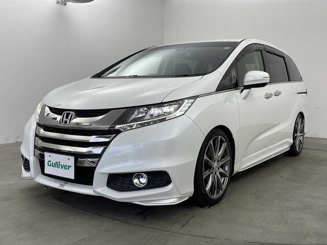 ホンダ オデッセイ アブソルート 兵庫県 2014(平26)年 6.5万km ホワイトオーキッドパール ・純正ナビ（フルセグ・CD・DVD・BT・HDMI）/・両側パワースライドドア/・クルーズコントロール/・衝突軽減ブレーキ/・社外19インチアルミホイール/・ハーフレザーシート/・LEDオートライト/・HKSサスペンション/・純正サスペンション車載/・ドライブレコーダー/・ビルトインETC/・後席オットマン/・カーテンエアバック/・ステアリングスイッチ/・アイドリングストップ/・社外フロアマット/・革巻きステアリング/・パドルシフト/・プッシュスタート/・スマートキー