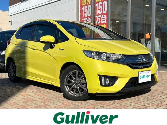 ホンダ フィット ハイブリット Sパッケージ 鳥取県 2013(平25)年 16.9万km アトラクトイエローパール ワンオーナー/スマートキー/パドルシフト/純正フルエアロ/シティブレーキサポート/レーンデパーチャーアラート/メーカーインターナビ/フルセグ・Bluetooth/バックカメラ/HDMI/USB入力/社外スピーカー/モデューロ製AWラジアル４本積込/LEDヘッドライト/フォグライト/ビルトインETC/保証書・取説