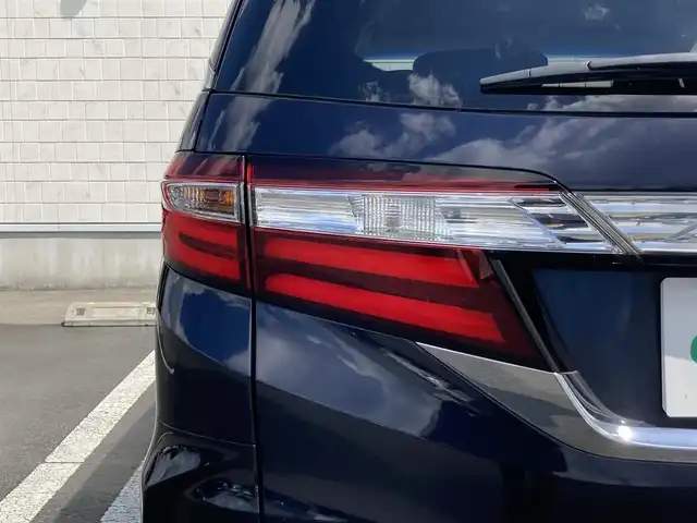 ホンダ オデッセイ アブソルート EX 静岡県 2015(平27)年 8.8万km プレミアムヴィーナスブラックP Honda SENSING/純正ナビ（VXM-152VFi）/   AM FM CD DVD Bluetooth SD　/フルセグTV/バックカメラ/ETC/アダプティブクルーズコントロール/ブラインドスポットモニタリング/運転席パワーシート/2列目プレミアムクレードルシート/オットマン/LEDヘッドライト/LEDルームランプ/パドルシフト/フロントフォグランプ/コンフォートビューパッケージ/純正18インチアルミホイール/スマートキー