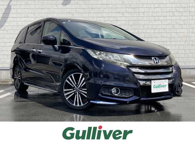 ホンダ オデッセイ アブソルート EX 静岡県 2015(平27)年 8.8万km プレミアムヴィーナスブラックP Honda SENSING/純正ナビ（VXM-152VFi）/   AM FM CD DVD Bluetooth SD　/フルセグTV/バックカメラ/ETC/アダプティブクルーズコントロール/ブラインドスポットモニタリング/運転席パワーシート/2列目プレミアムクレードルシート/オットマン/LEDヘッドライト/LEDルームランプ/パドルシフト/フロントフォグランプ/コンフォートビューパッケージ/純正18インチアルミホイール/スマートキー